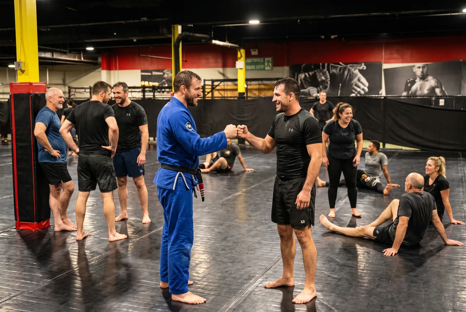 Two training partners sharing a fist bump after a drill at Xtreme Couture