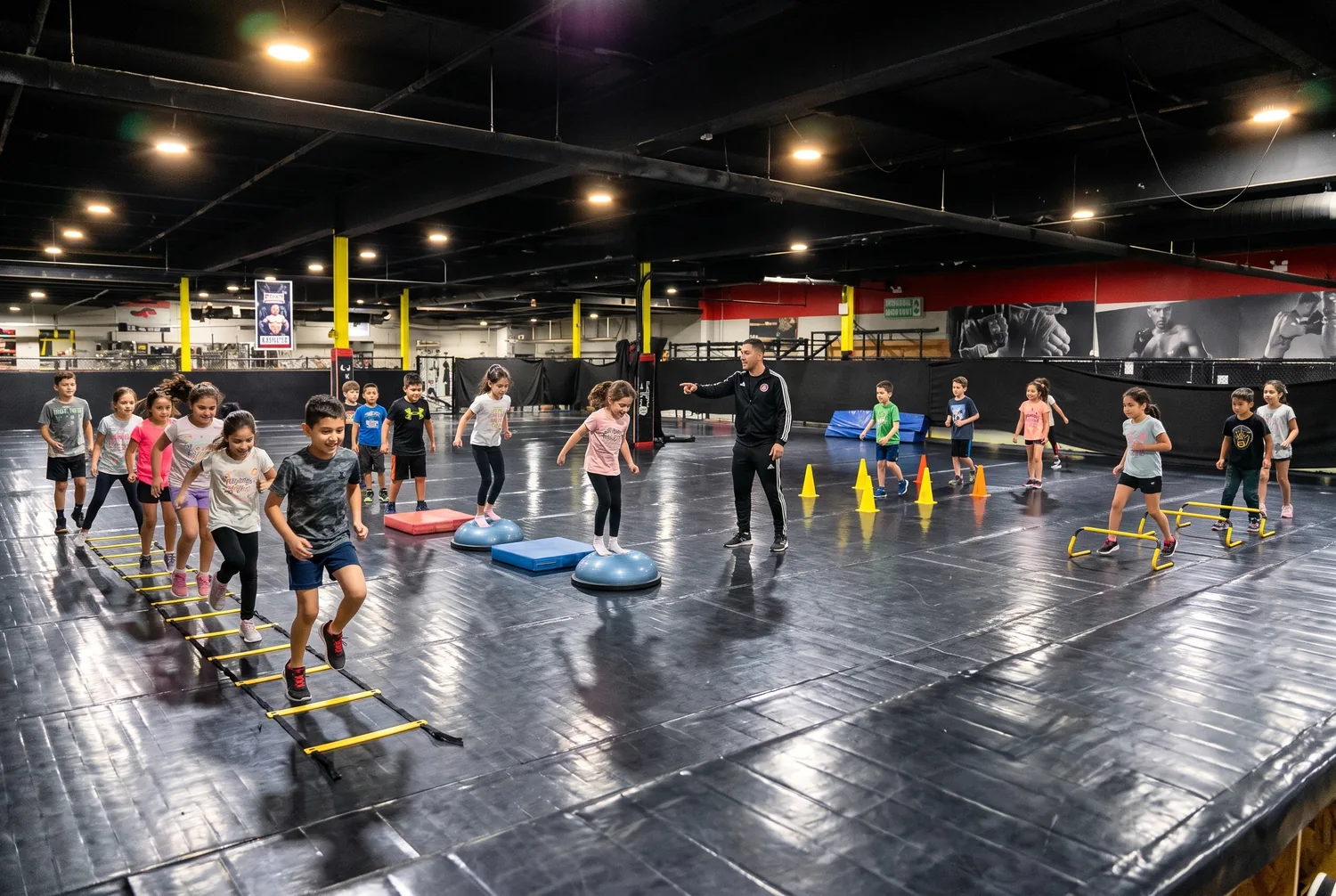 Kids moving through agility and coordination drills in the gym